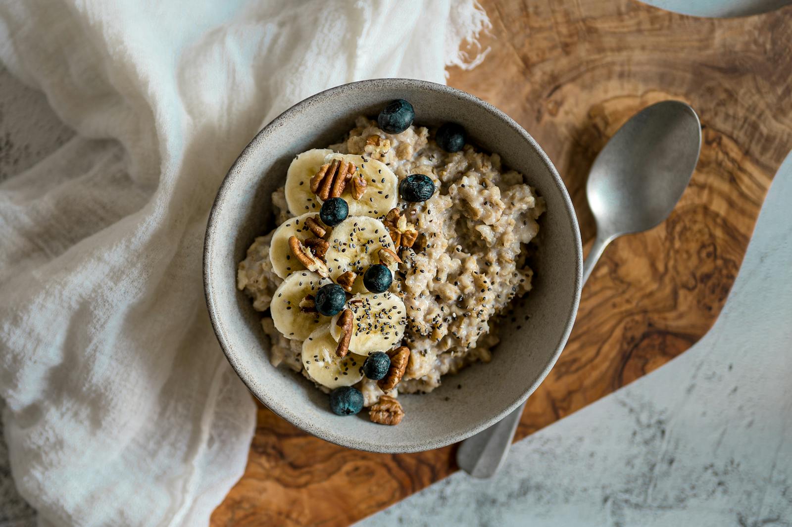 A bowl of oatmeal topped with banana, blueberries, pecans and chia seeds, the breakfast at the centre of the most-asked gluten-free question.