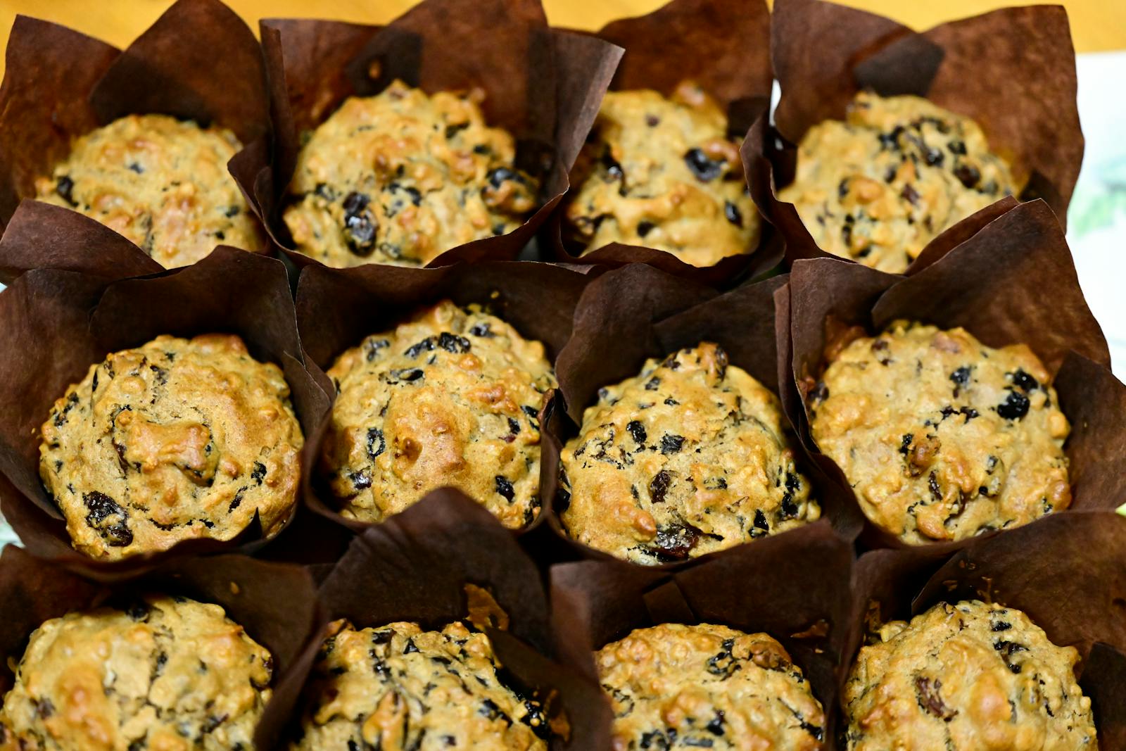 A platter of homemade oat and walnut muffins with raisins, the kind of recipe that turns out forgiving and tender every time with oat flour.