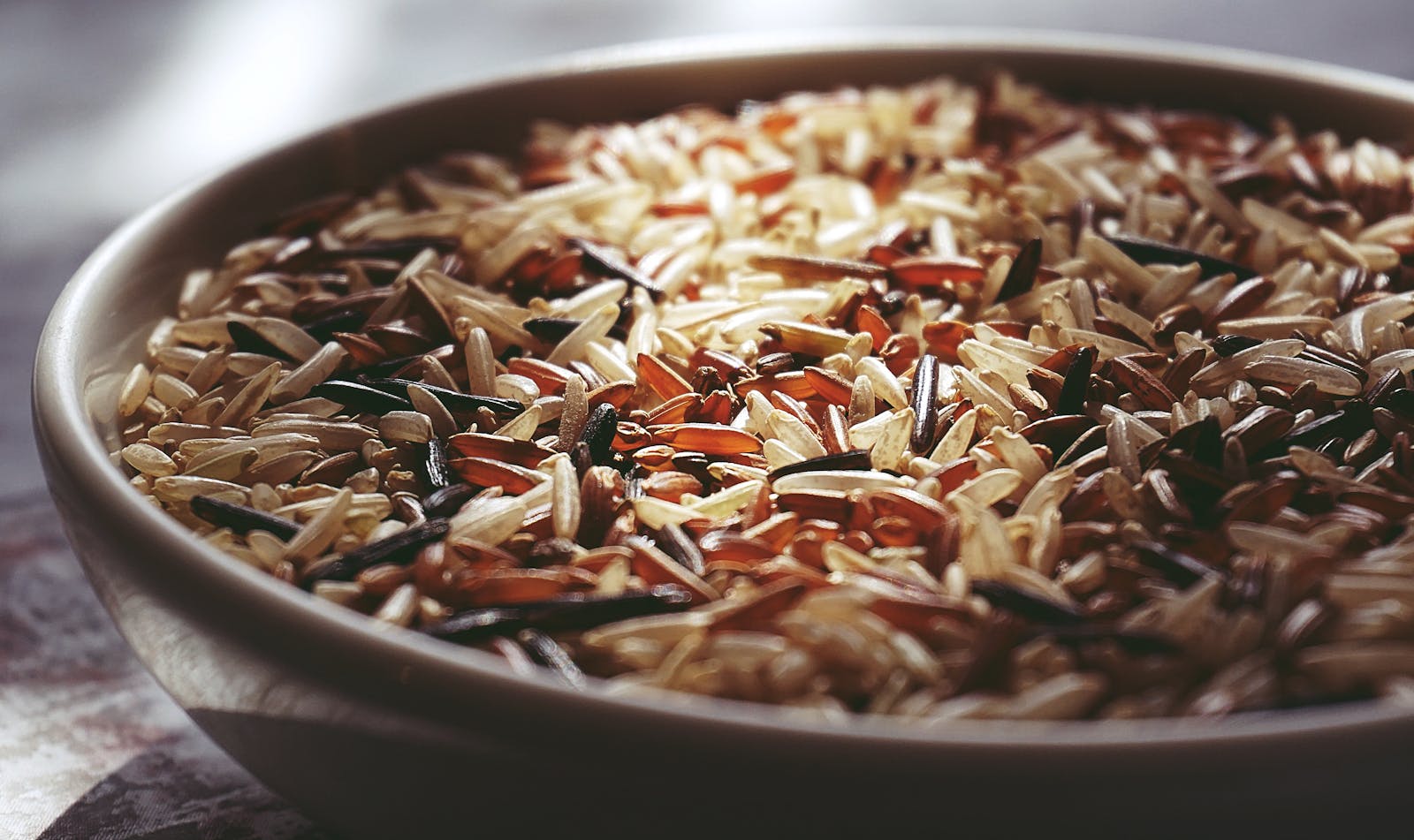 Bowl of cooked dark wild rice grains